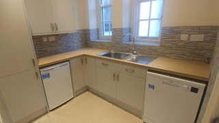Splash back tiling designed around the kitchen kitchens